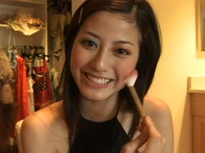 Pretty Japanese brunette Yumi Sugimoto puts on her makeup